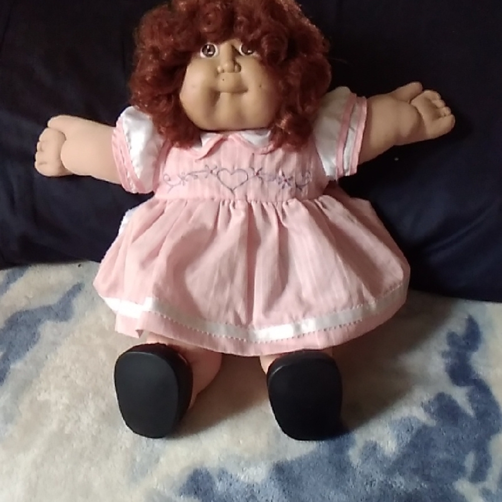 Adorable Pink Doll with Curly Hair